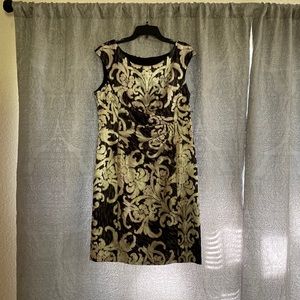 A knee length black design satin zip up dress